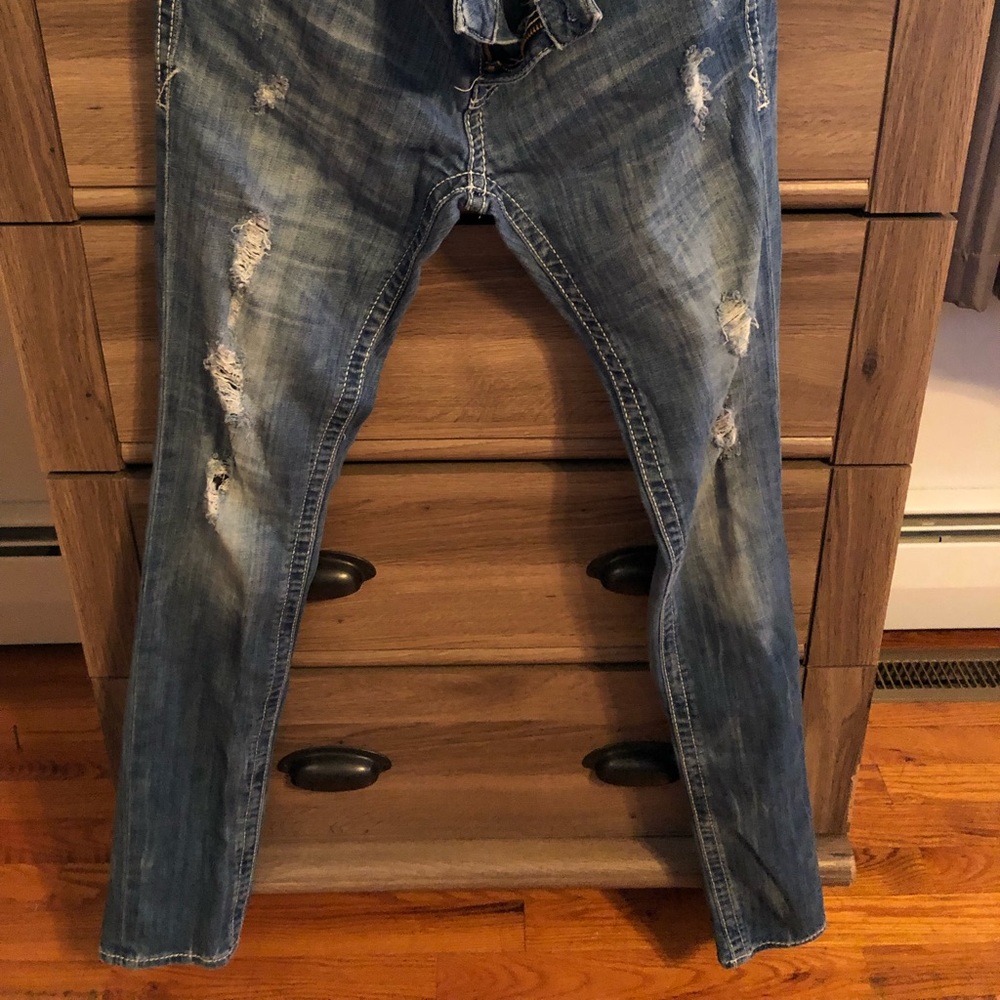 Buckle black skinny jeans